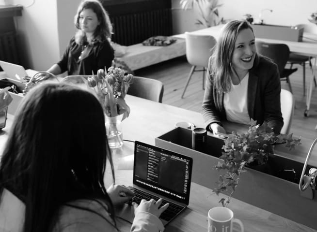 Three women working on their laptops